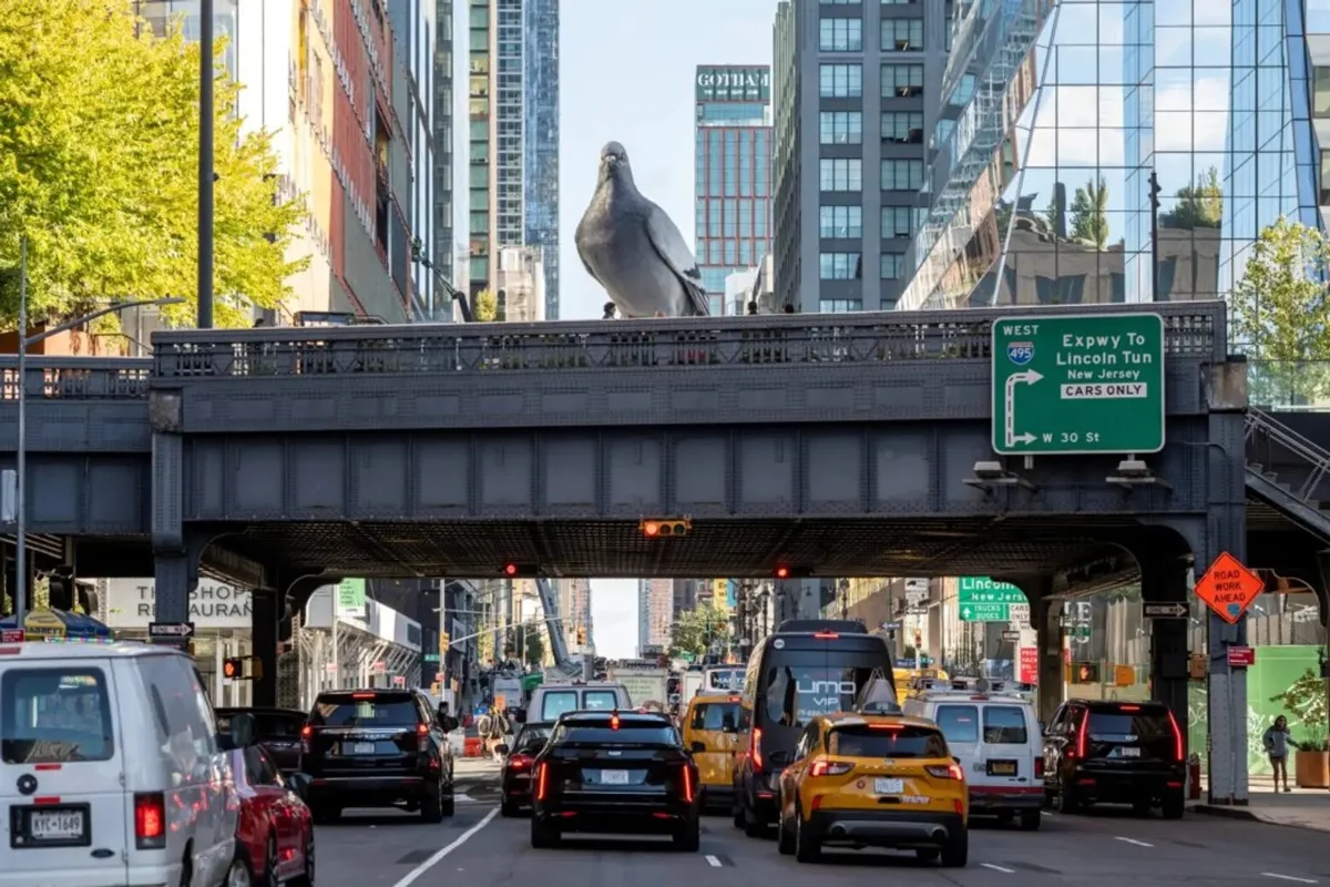 16-foot-tall 'Dinosaur' is an aluminium pigeon by Iván Argote perched on New York's intersection