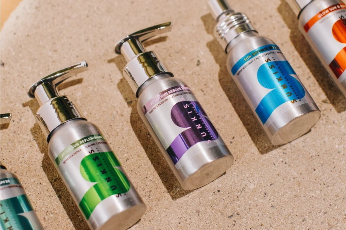 SunKiss products, packaged in aluminium bottles, all for eco-friendly beauty enhancement