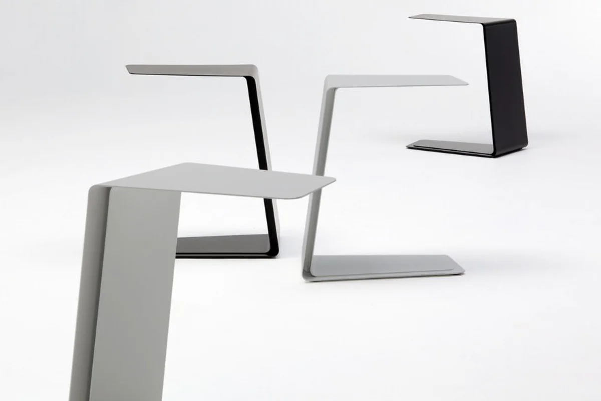 Mira table by Mark Gabbertas uses aluminium sheet layering process for its structure