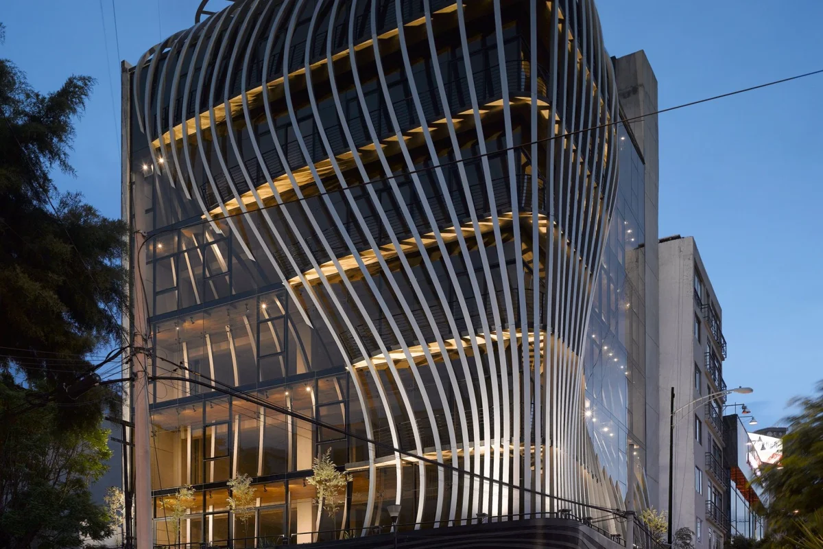 Belzberg Architects forms curved aluminium strip structure around an office building in Mexico